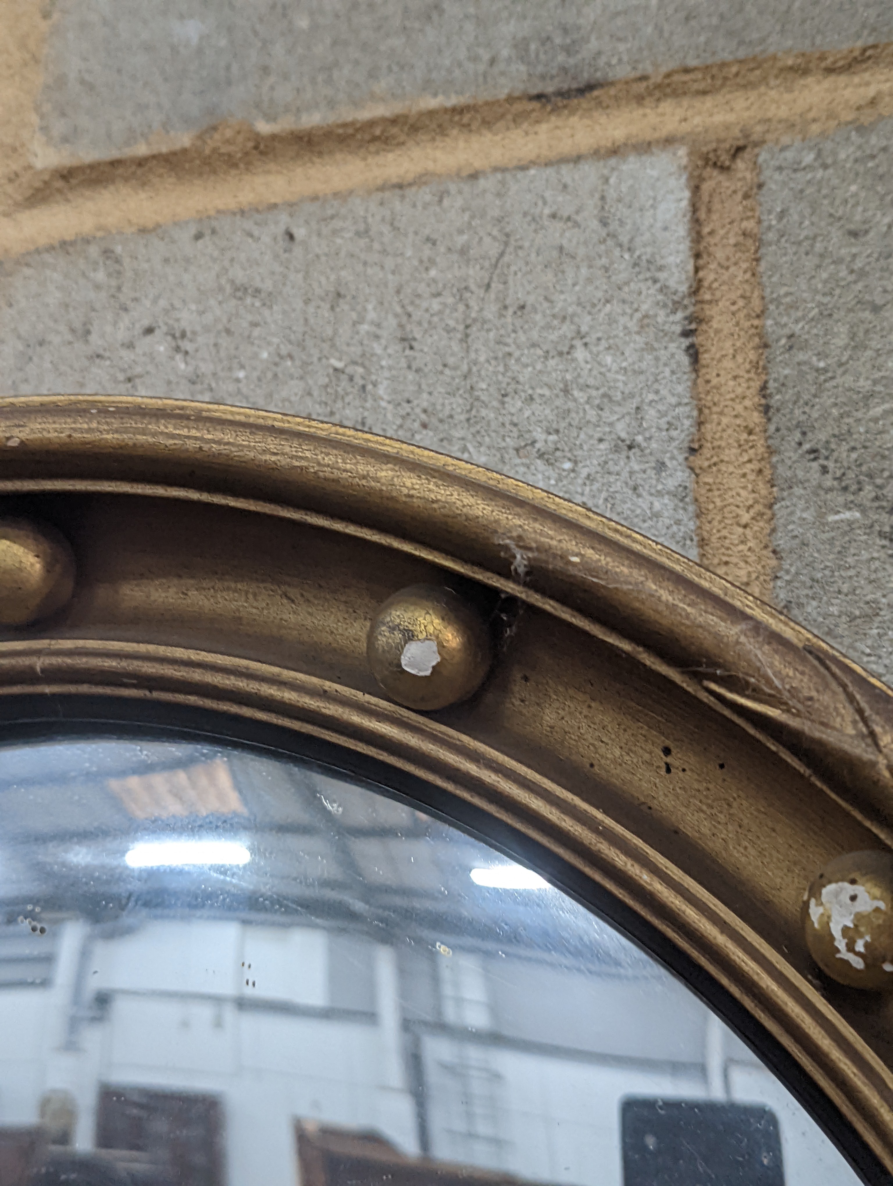 A Regency style circular gilt framed convex wall mirror, diameter 45cm